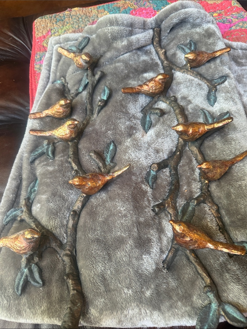 A pair of 1960 birds on a branch cast iron wall art 24in long